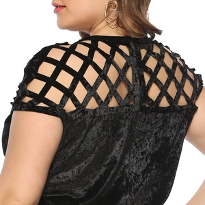 Detailed back view of black velvet dress with geometric lattice cutout design