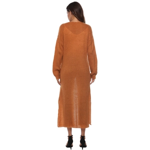 Detail of long orange knit cardigan showing side slits and textured knit fabric on back