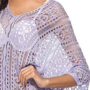 Close-up of lavender crochet knit beach cover-up showing intricate geometric lace patterns