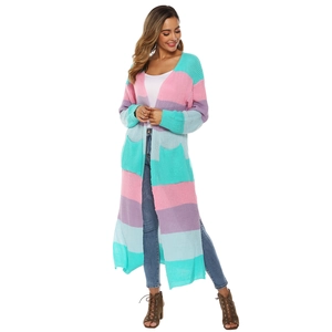 Detail of color-block knit cardigan featuring mint, pink and blue stripes with pockets