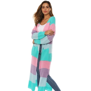 Detail of colorful striped knitted cardigan with V-neckline and large front patch pockets