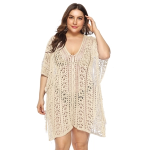 Detailed view of beige crochet hollow out knit beach cover up with V-neck and split design