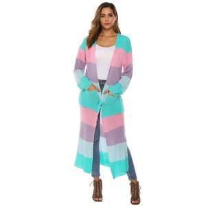 Detail view of colorful patchwork knit cardigan with large pockets and ribbed cuffs