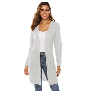 Detail of light gray long-sleeve knit cardigan with large side pockets and thick texture