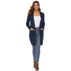 Close-up of navy blue long knit cardigan featuring functional large front square pockets