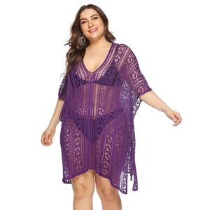 Detailed close-up of dark purple crochet beach cover-up with intricate hollow-out patterns
