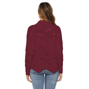 Detailed back view of a burgundy knit sweater with hollow wave patterns and scalloped hem