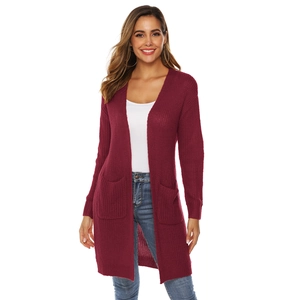 Close-up of wine red long-sleeved knit cardigan with textured knit and large side pockets