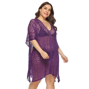 Close-up of purple crochet hollow-out knit beach cover-up with intricate V-neck detail