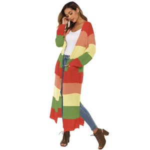 Detail of colorful striped knit cardigan showing thick texture and side slit design