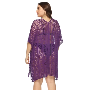 Detail of purple crochet beach cover-up featuring floral lace hollow and fringe tassels