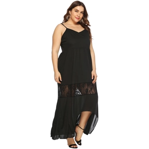 Detail view of plus size black dress showing lace patchwork and irregular hemline