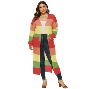 Macro detail of rainbow striped knit cardigan featuring large pockets and woven texture