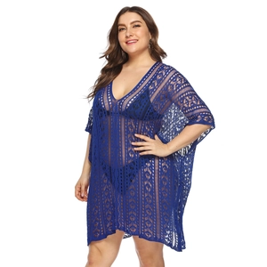 Close-up of royal blue crochet beach cover-up showing V-neck and hollow-out lace texture