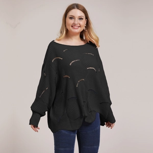 Detail of black hollow-out knit texture and batwing sleeve on this loose sweater