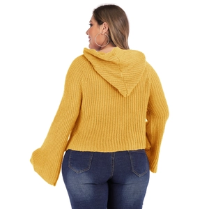 Detail view of ginger yellow oversized hoodie with texture and flared bell sleeves