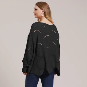 Detailed back view of black loose-fit knit sweater with hollow-out arched patterns