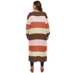 Back view of a long oversized knit cardigan with colorful stripes and side slits