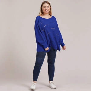 Close-up of royal blue hollow knit texture on loose oversized long-sleeve sweater