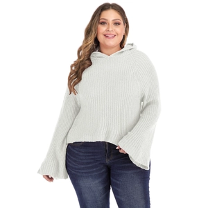 Detail of white chunky knit plus size hoodie with dramatic flare sleeves and texture