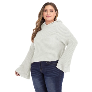 Detail of white chunky knit hoodie with oversized bell sleeves and textured pattern