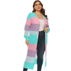 Detail of colorful striped knitted long cardigan with front pockets and ribbed cuffs