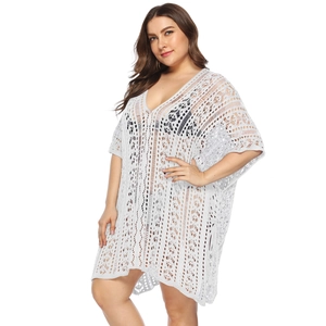 Detailed close-up of white crochet hollow-out pattern on a plus size V-neck beach cover-up