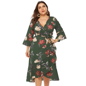 Floral plus size wrap dress in dark green with ruffle hem and V-neckline styling
