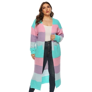 Detail shot of oversized knit cardigan with colorful stripes and large front pockets