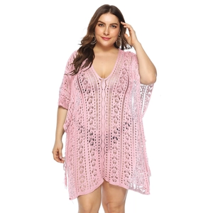 Front view of pink crochet beach cover-up featuring hollow-out knit texture and V-neck