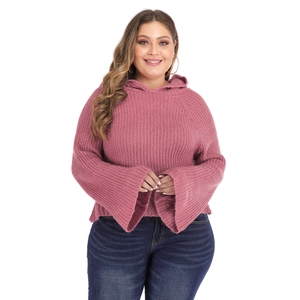 Plus size pink hooded knit sweater with wide bell sleeves on a model in white background