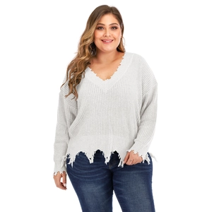 Plus size white V-neck knit sweater with distressed fringe details and relaxed fit