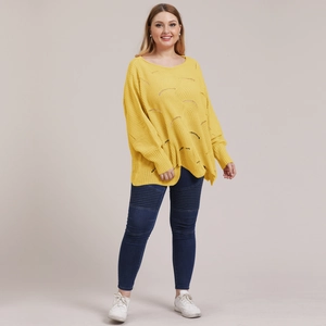 Detail of oversized yellow knit sweater with wavy hollow texture and crew neck design