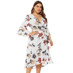 Plus size white floral wrap dress with flare sleeves and asymmetric ruffle hem design