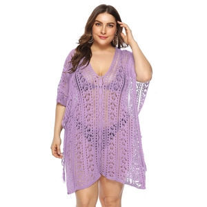 Detailed close-up of purple hollow-out knit beach cover-up with intricate geometric pattern