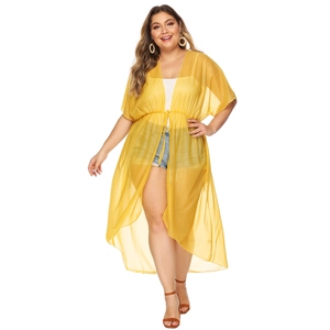 Detail view of yellow chiffon beach cover-up featuring adjustable drawstring waist and V-neck