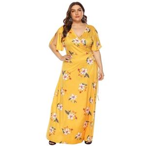 Detail of plus size yellow wrap dress with floral print, V-neck, and split short sleeves