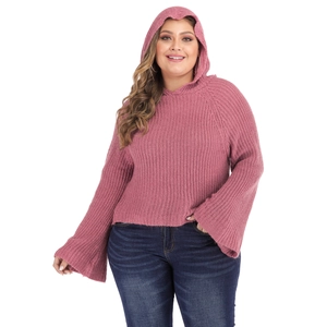 Close-up of pink knit sweater featuring oversized hood and flared bell sleeves