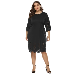 Detailed view of black laser-cut floral hollow patterns on dress sleeves and hemline
