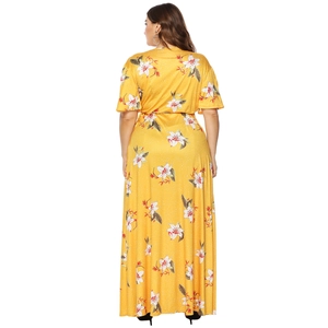 Plus size yellow floral maxi dress with short sleeves and white flower print back view