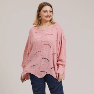 Detail of soft pink oversized hollow knit sweater with wave patterns and ribbed edges