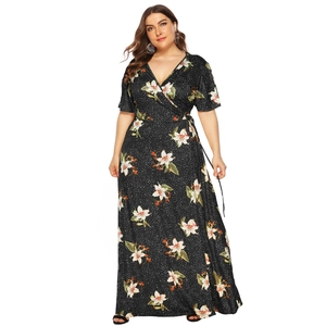 Plus size floral V-neck maxi dress with white lilies on black polka dot pattern