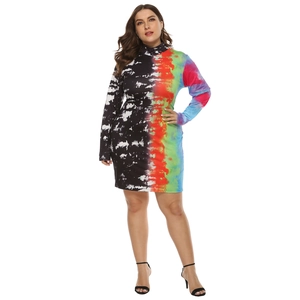 Plus size slim fit long sleeve mini dress featuring asymmetric rainbow and black tie-dye print