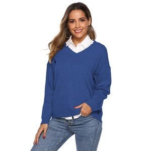 Detailed view of women's royal blue V-neck knit sweater with ribbed cuffs and hem