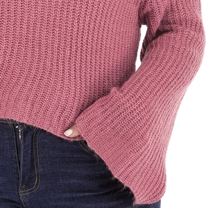 Close-up of rose pink chunky knit sweater featuring elegant wide bell sleeves design