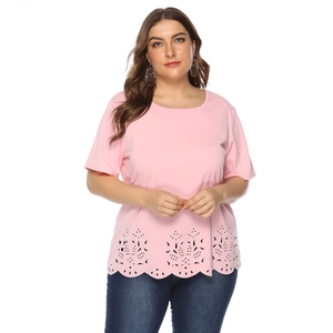 Close-up of pink plus-size T-shirt featuring laser-cut hollow floral hem and wave edges