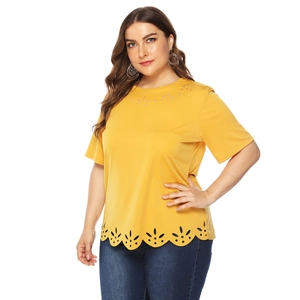 Detailed view of bright yellow plus size t-shirt with laser-cut floral hollow out patterns