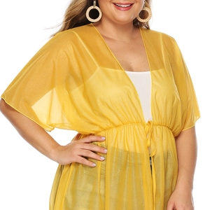 Detail of a bright yellow sheer chiffon cardigan with adjustable drawstring waist and wide sleeves