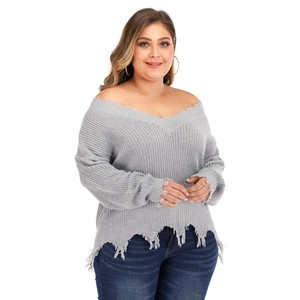 Women's plus size grey V-neck knit sweater with trendy distressed frayed edges