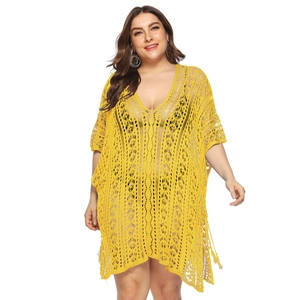 Close-up of bright yellow crochet hollow knit pattern on plus size beach cover-up